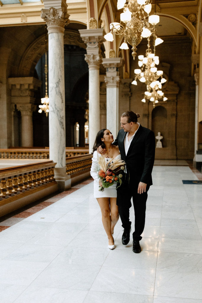 bride and groom posing after courthouse in indianapolis elopement 