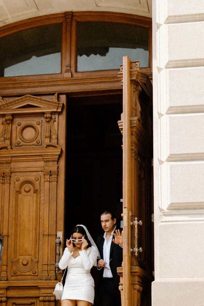 bride and groom posing after courthouse in indianapolis elopement 