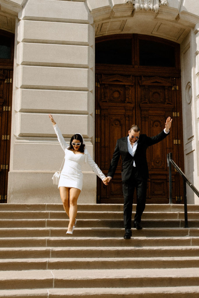 bride and groom posing after courthouse in indianapolis elopement 