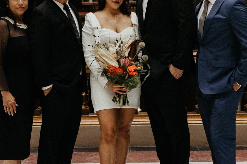 bride and groom posing after courthouse elopement 