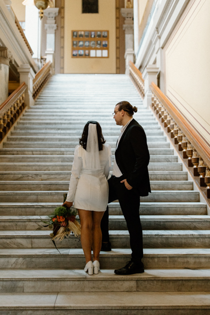 bride and groom posing after courthouse in indianapolis elopement