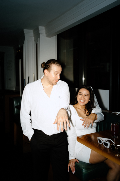 couple having drinks after elopement at spoke and steele bar in indianapolis  