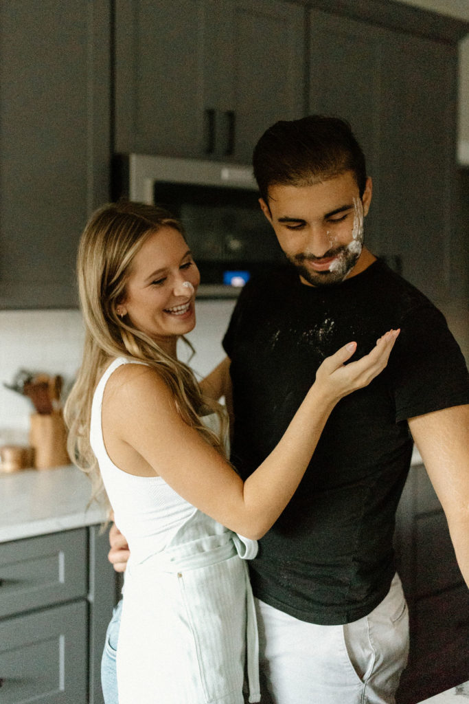 Playful couple during engagement photos