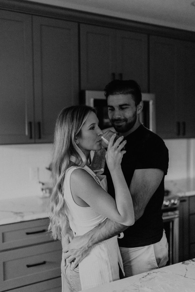 Couple drinking wine during in home photoshoot