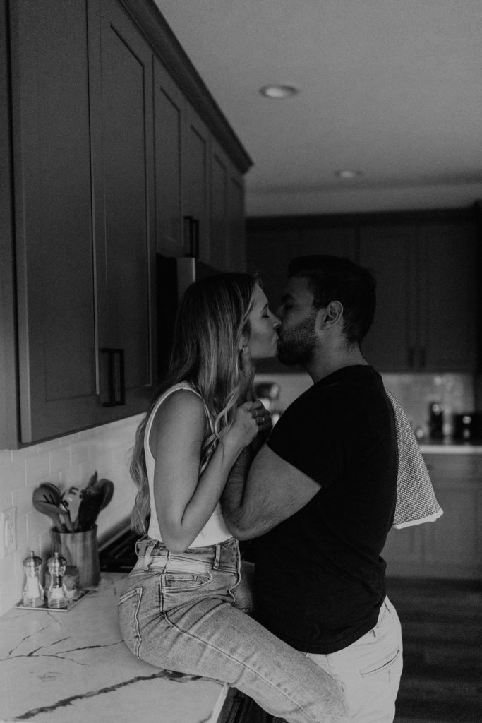 Couple kissing during in home photoshoot