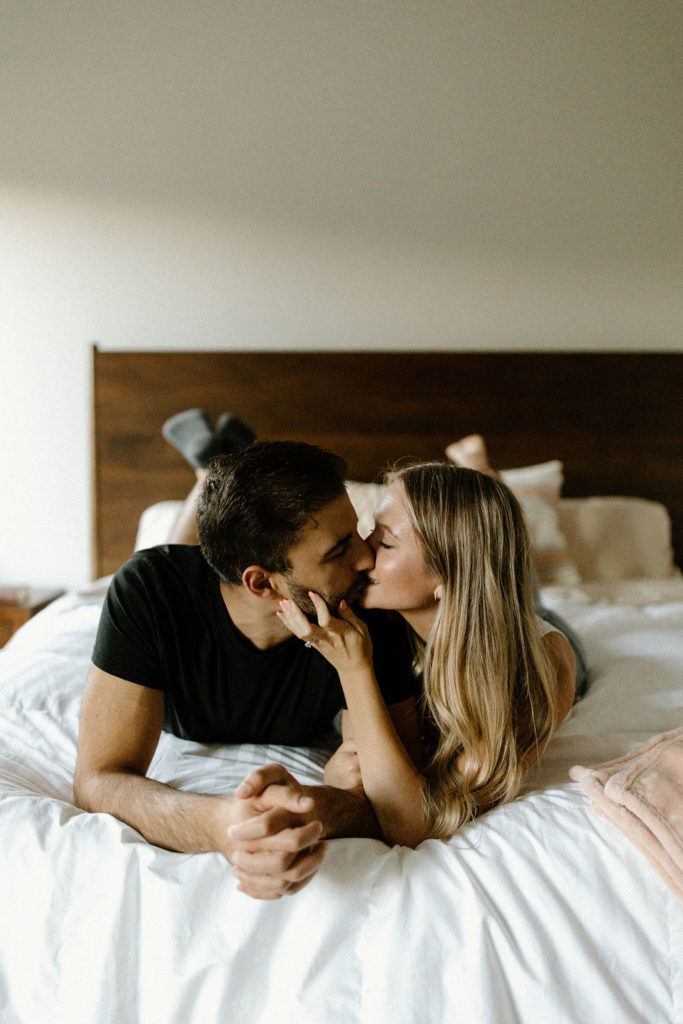 Couple kissing during in home photoshoot