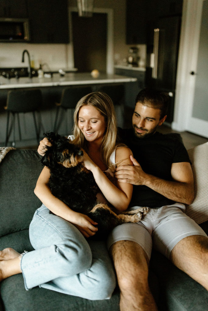 Couple posing with dog during in home photoshoot