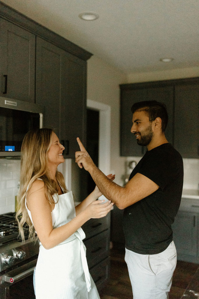 Playful couple during engagement photos