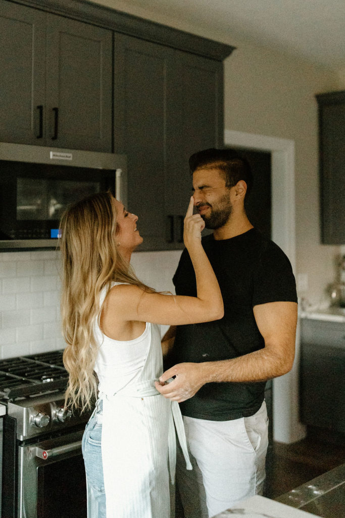 Playful couple during engagement photos