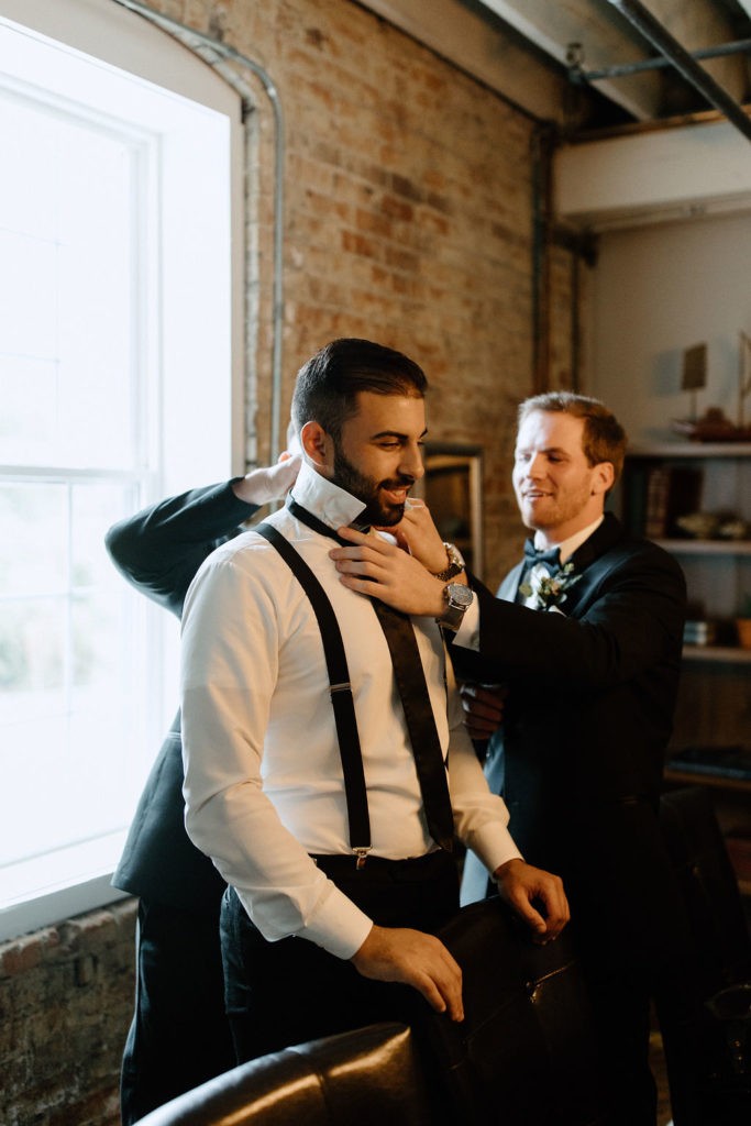 Groom getting ready before Indiana wedding ceremony at Bread and Chocolate wedding venue 