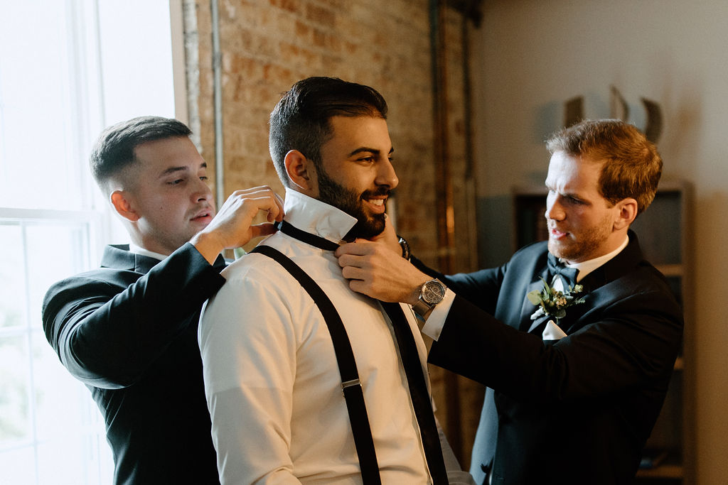 Groom getting ready before Indiana wedding ceremony at Bread and Chocolate wedding venue 