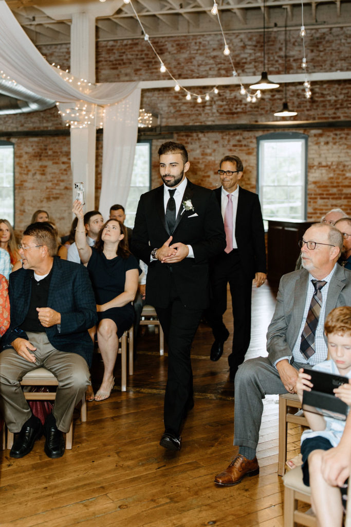 Groom walking to the altar