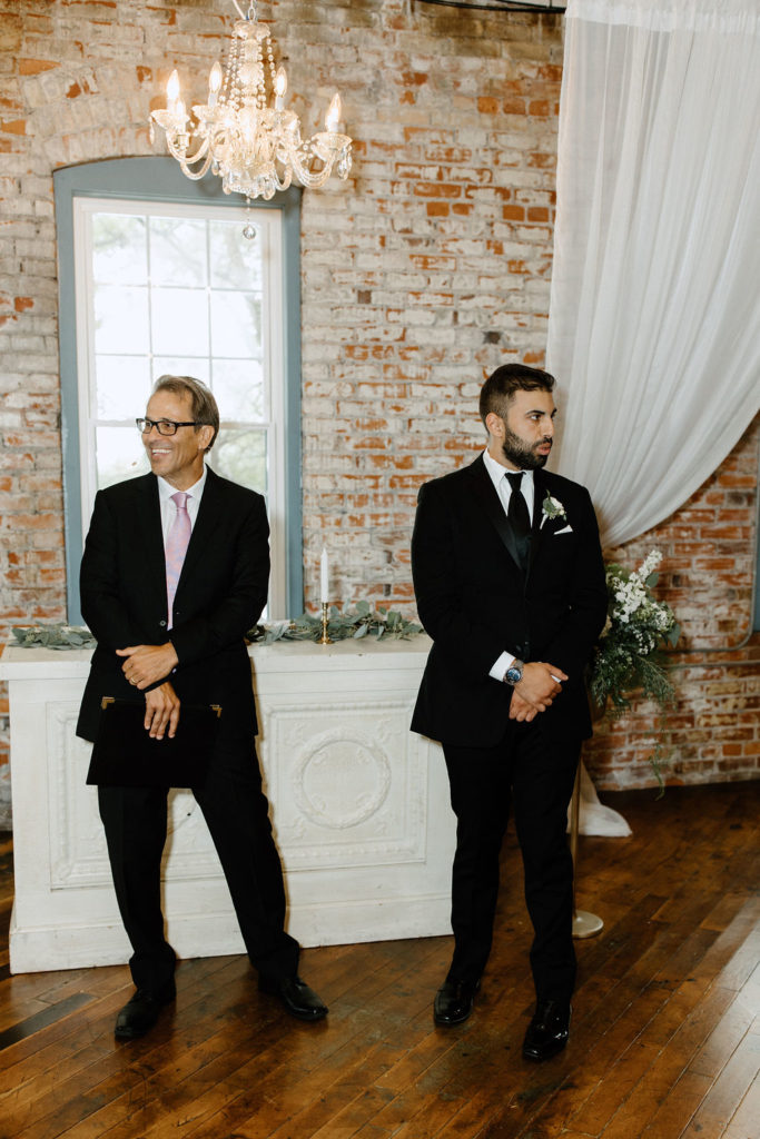 Groom waiting at the altar