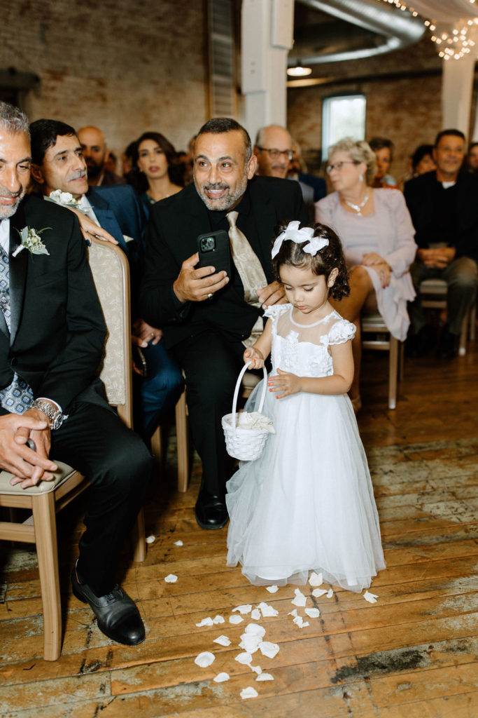 Flower girl walking down the aisle