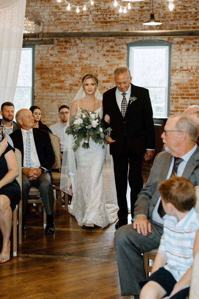 BRIDE WALKING DOWN THE AISLE WITH HER FATHER