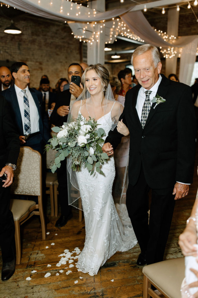 BRIDE WALKING DOWN THE AISLE WITH HER FATHER