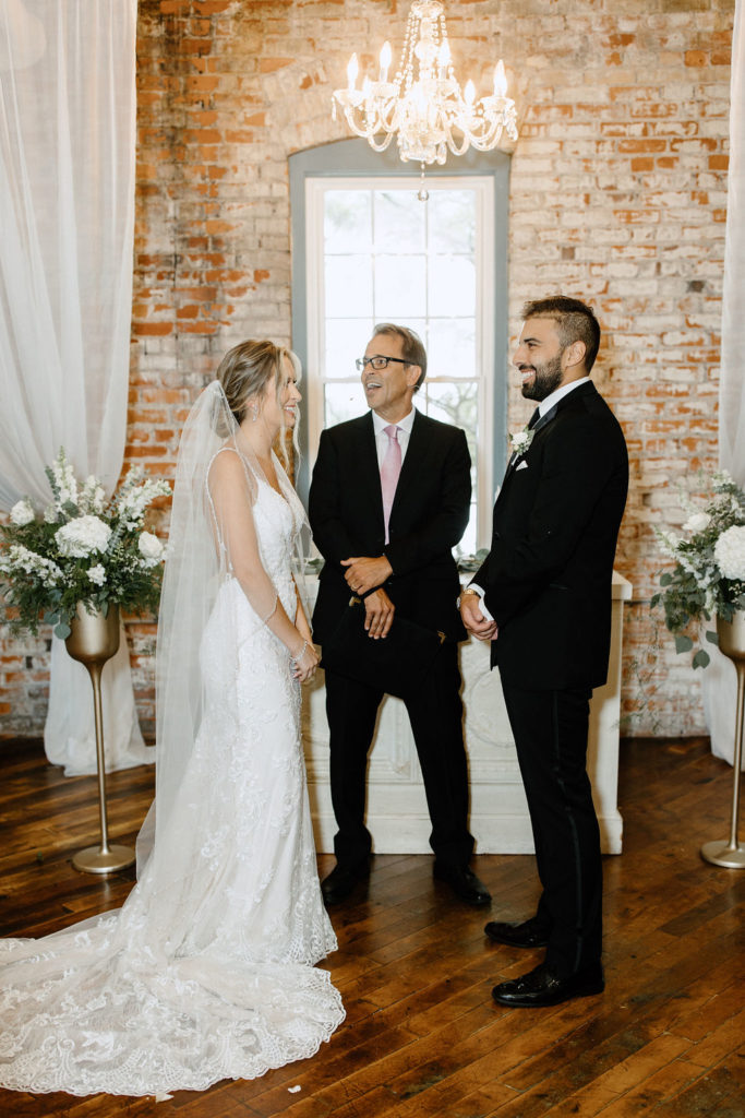 Bride and groom at the atlar at bread and chocolate wedding venue in south bend indiana