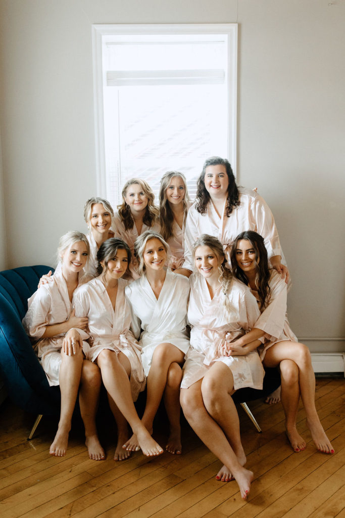 Bride and bridesmaids in robes before ceremony