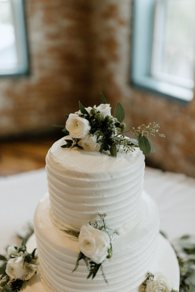 Sage green and white color schemes wedding cake