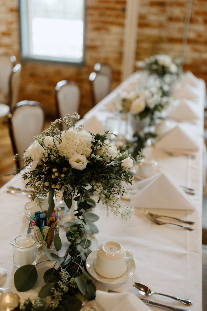 Sage green and white color schemes wedding table and decor