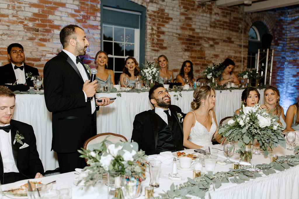 bride and groom during wedding speeches