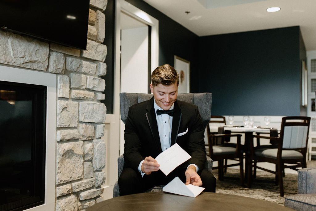 groom reading letter from bride