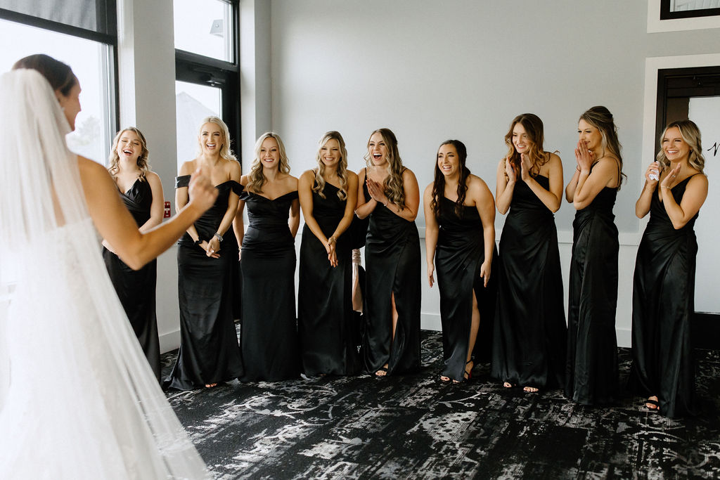 brides first look with bridesmaids