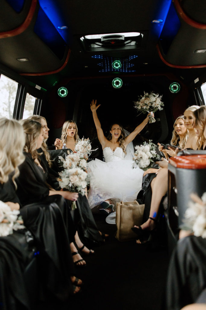 bride and bridesmaids on bus heading to wedding ceremony