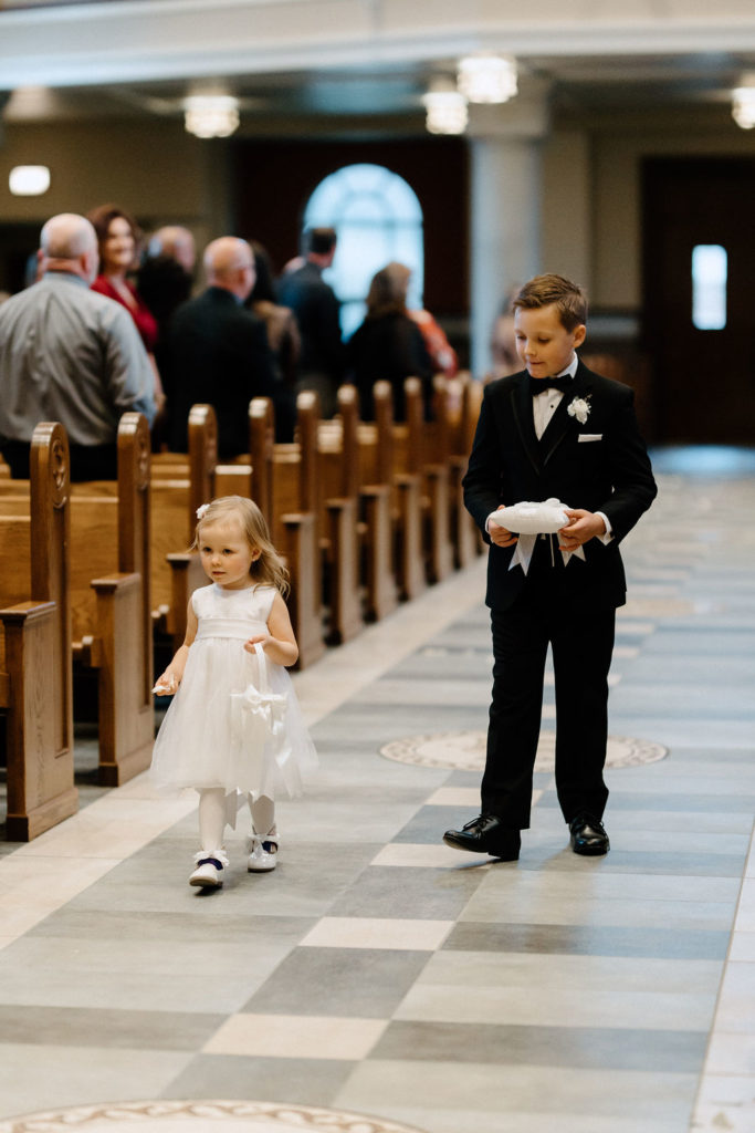 flowergirl and ring bearer walking down the aisle