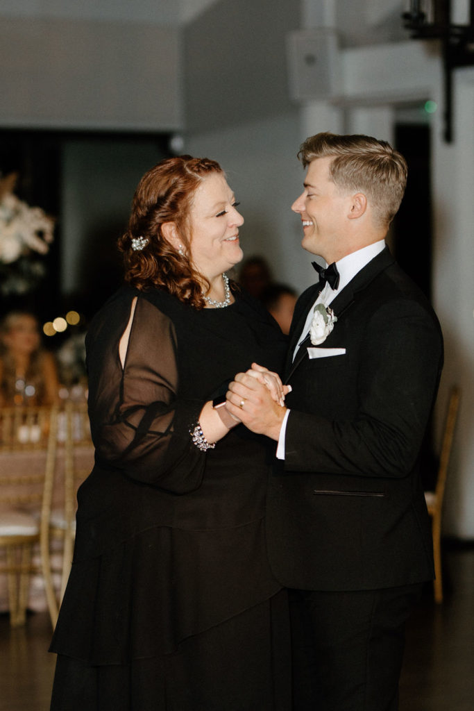 groom dancing with mother