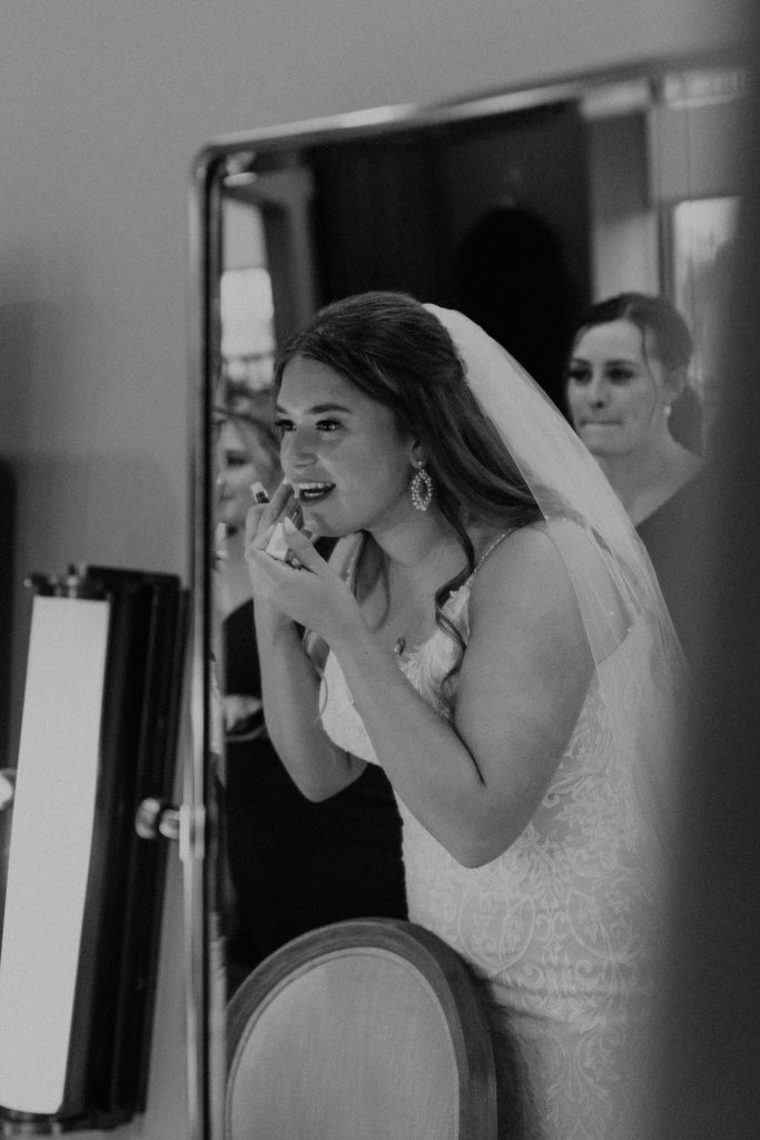 Bride getting dressed before wedding ceremony