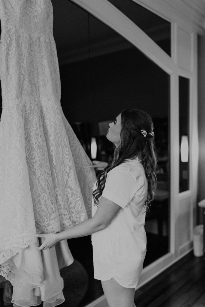 Bride getting dressed before wedding ceremony