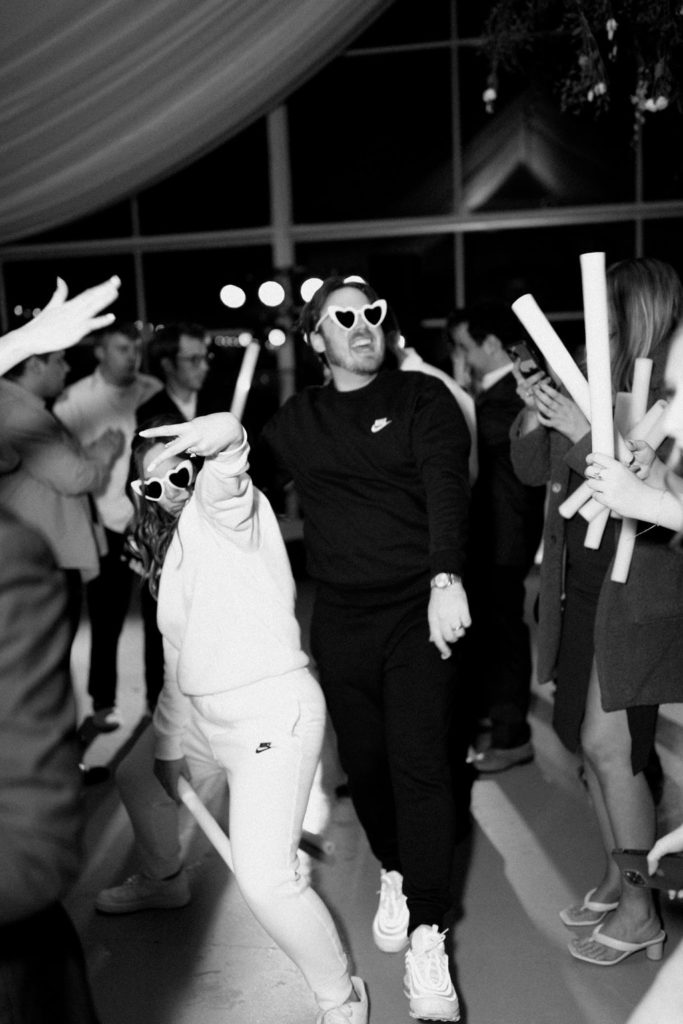 Bride and groom at reception with glowsticks