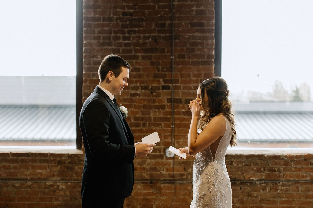 Bride and groom exchanging private vows