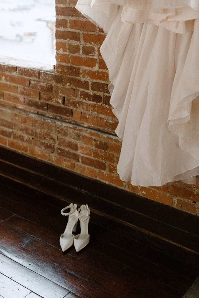 Wedding dress and shoes by Indianapolis wedding photographer Brianna Dutcher