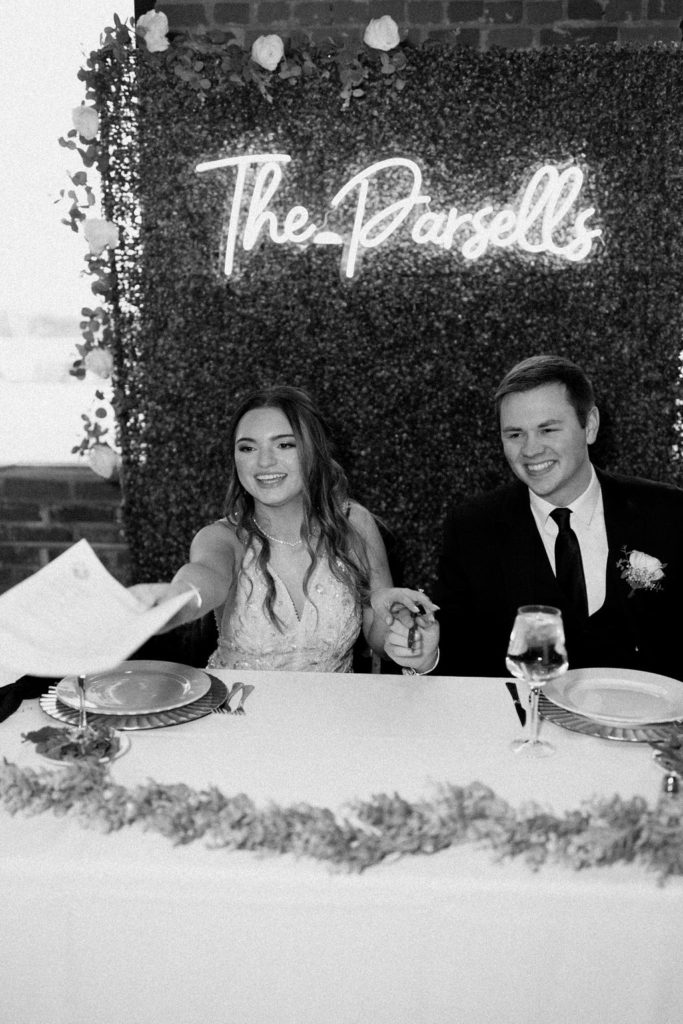 Bride and groom signing marriage certificate