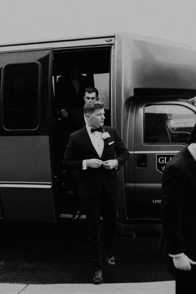 Groom on bus before wedding ceremony