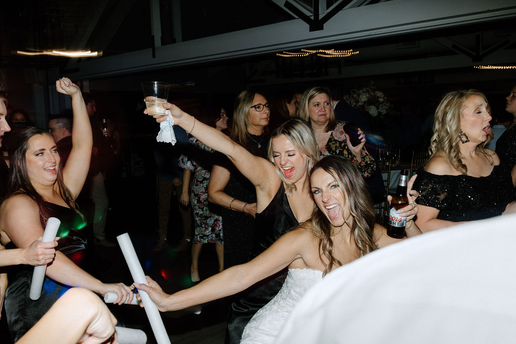 Wedding guests dancing during reception