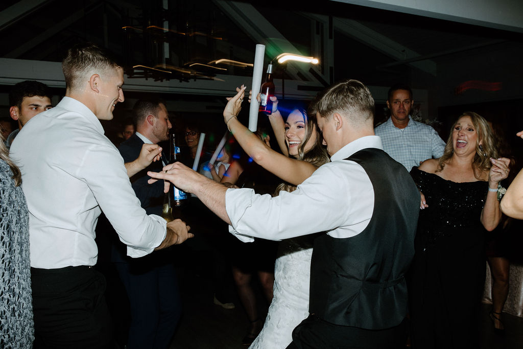 Wedding guests dancing during reception