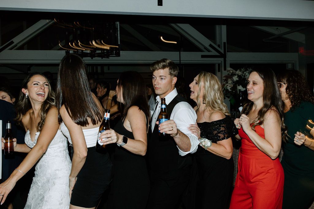 Wedding guests dancing during reception