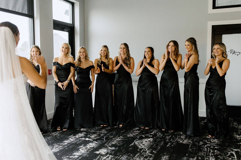 Brides first look with bridesmaids