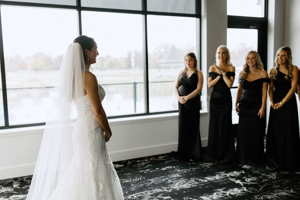 Brides first look with bridesmaids