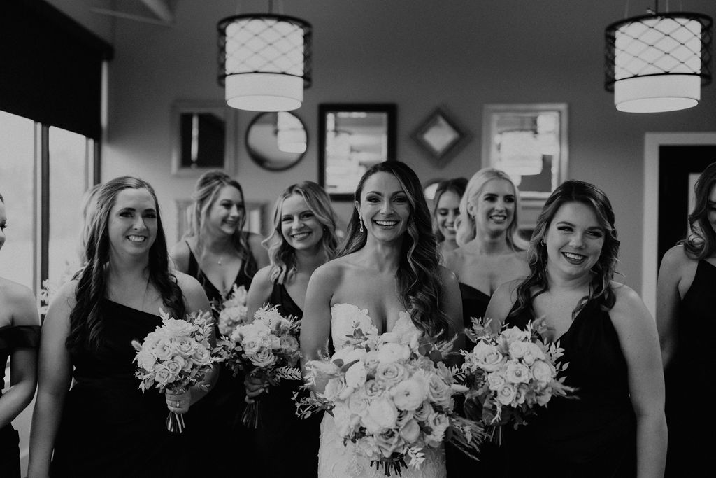 Bride and bridesmaids before wedding at The Morris Park Country club wedding venue in South Bend, IN