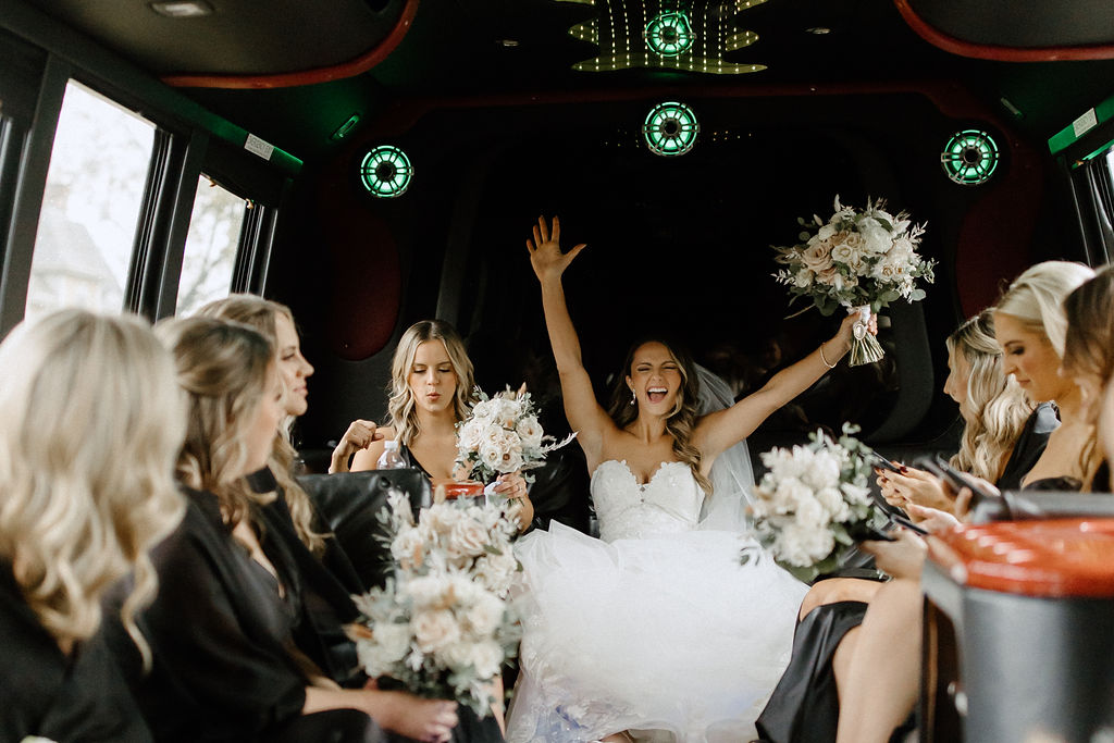 Bride and bridemaids on bus before wedding at The Morris Park Country club wedding venue in South Bend, IN