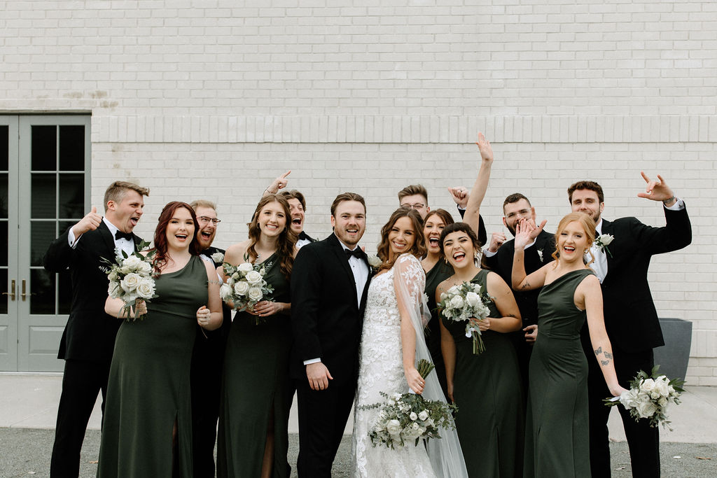 Bridal party posing for photos at The Ritz Charles in Carmel, Indiana