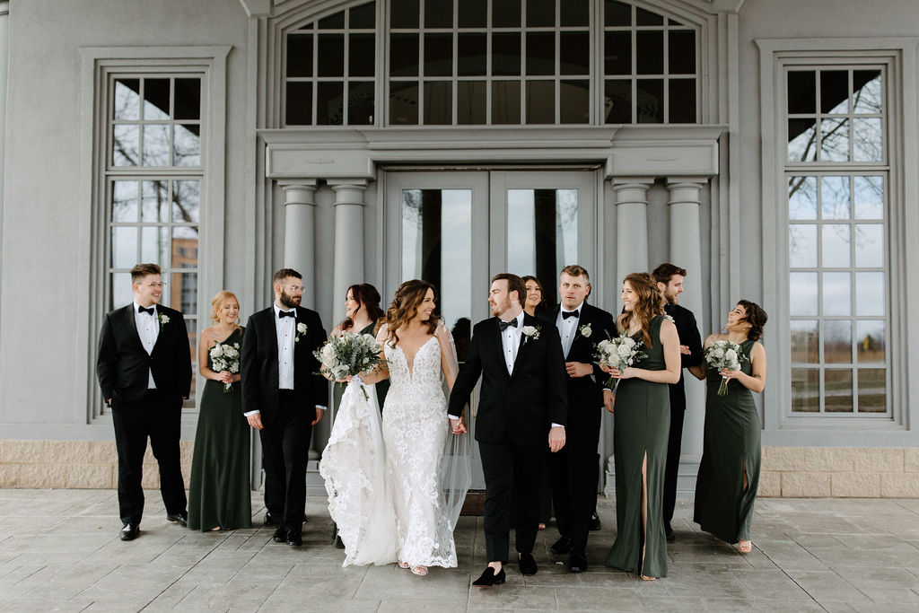 Bridal party posing for photos at The Ritz Charles in Carmel, Indiana